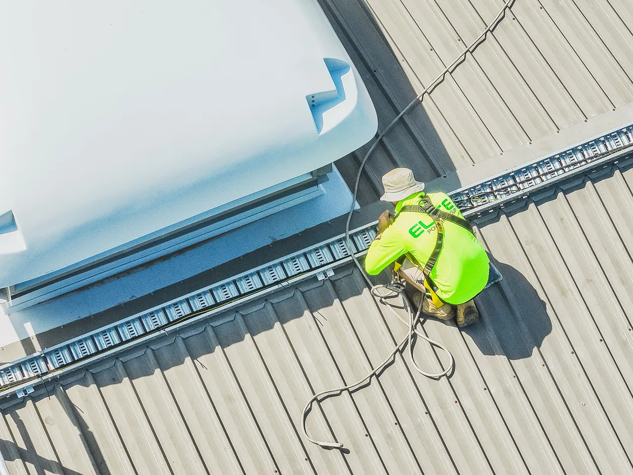 Solar Installer running cables Solar Installer running cables